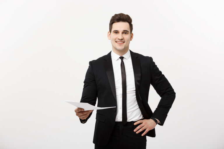Business and Job Concept: Elegant man in the suit holding resume for job hiring in the bright white interior
